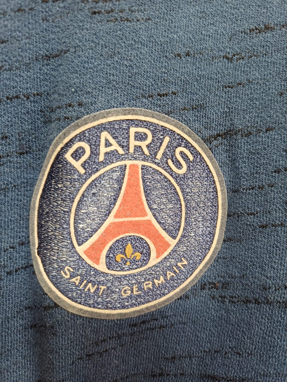 Paris Saint-Germain FC Official Merchandise Camiseta de Moda Slub Melange Talla L (Azul / Gris)